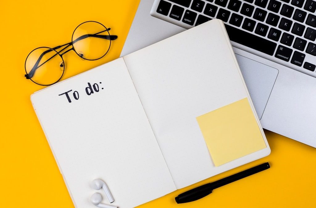 Home office desk workspace with laptop on yellow background. Flat lay, top view girl boss work business concept. Work at home concept on coronavirus quarantine